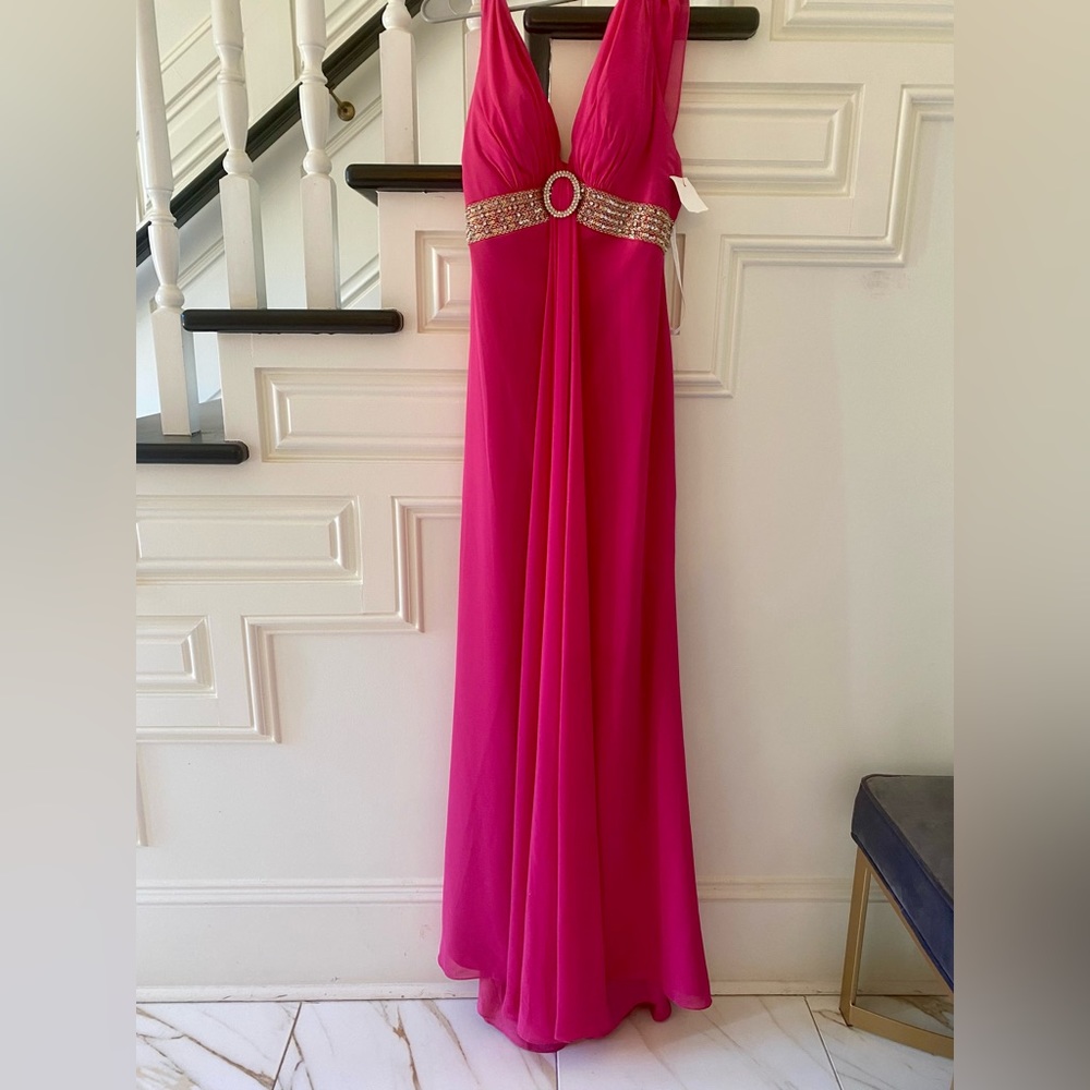 Fuschia formal dress with crystals at waist and shoulders.